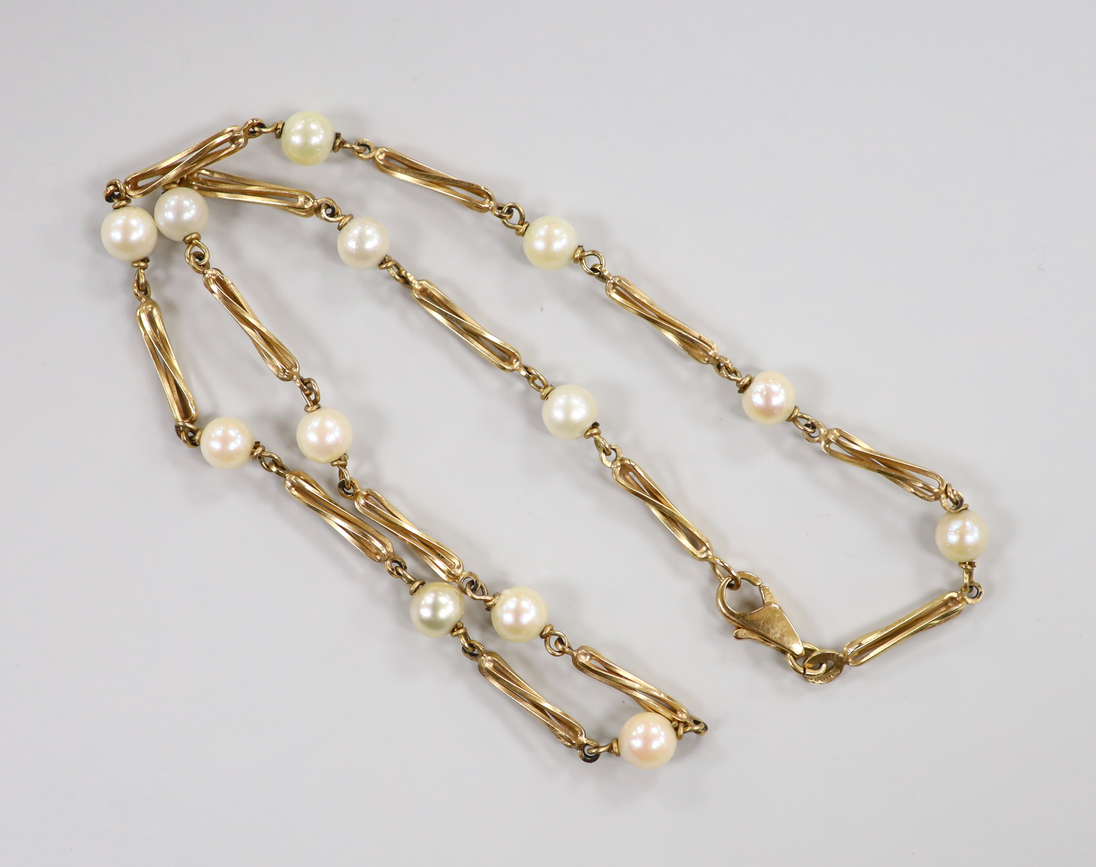 A modern 9ct gold, cultured pearl and entwined bar link necklace, 38cm, gross weight 10.8 grams.